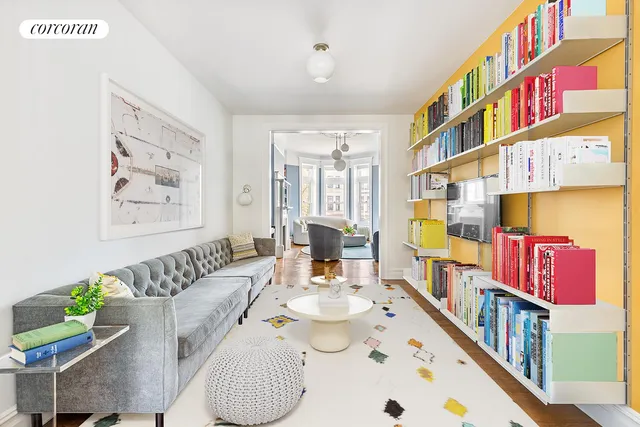 a living room with a book shelf