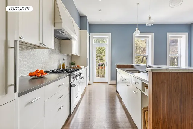 a living room with furniture and a book shelf