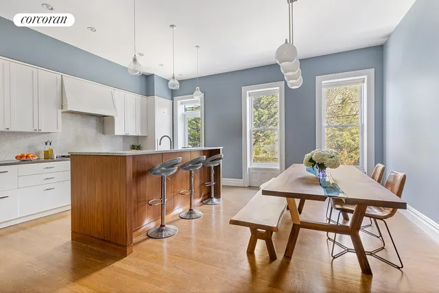 a kitchen with stainless steel appliances a refrigerator and a stove top oven