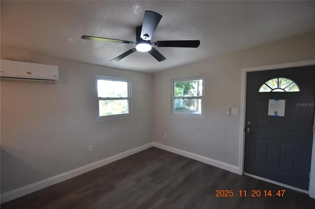 a view of an entryway with wooden floor