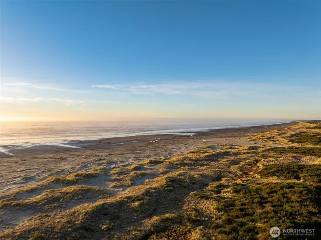 an aerial view of ocean and beach