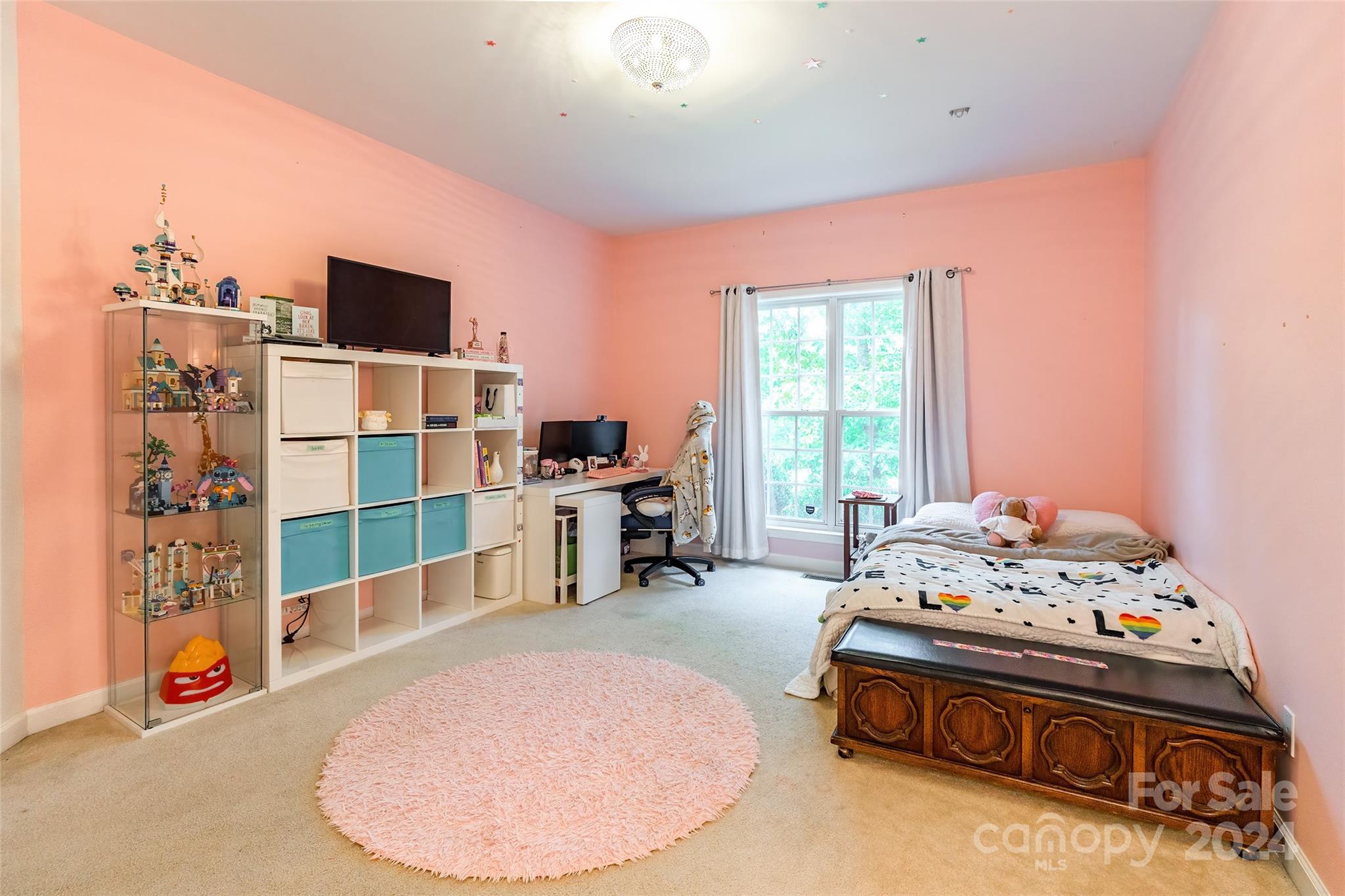 4710 Steepleton Way Charlotte, NC 28215 - Photo 22 of 29 a bed room with a bed and a television