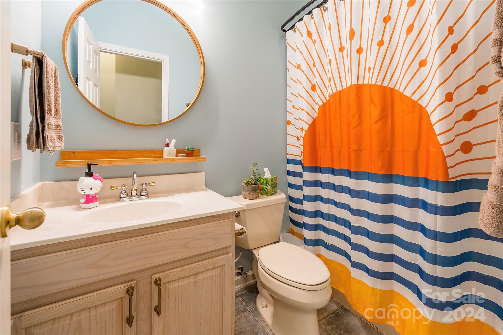 4710 Steepleton Way Charlotte, NC 28215 - Photo 24 of 29 a bathroom with a sink and a mirror