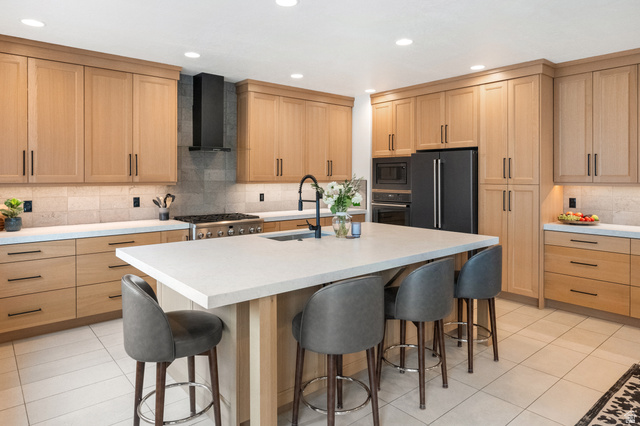 11617 South Wildrye Field Way Draper, UT 84020 - Photo 9 of 53 Kitchen featuring white oak cabinetry, decorative backsplash, a kitchen breakfast bar, black appliances, and recessed lighting