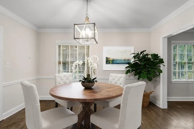 a view of a dining room with furniture window and wooden floor