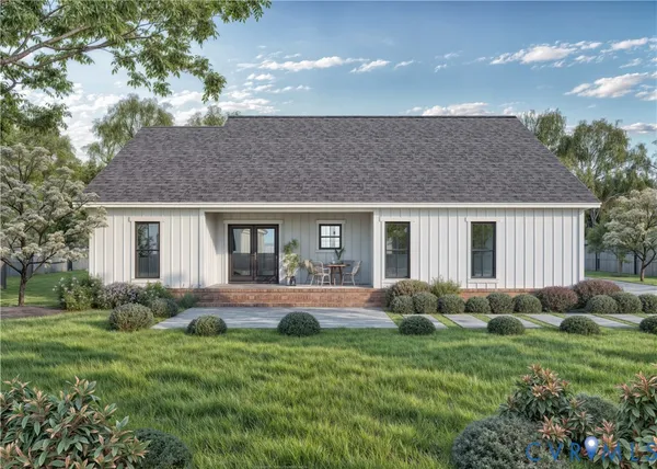 a front view of house with yard and green space