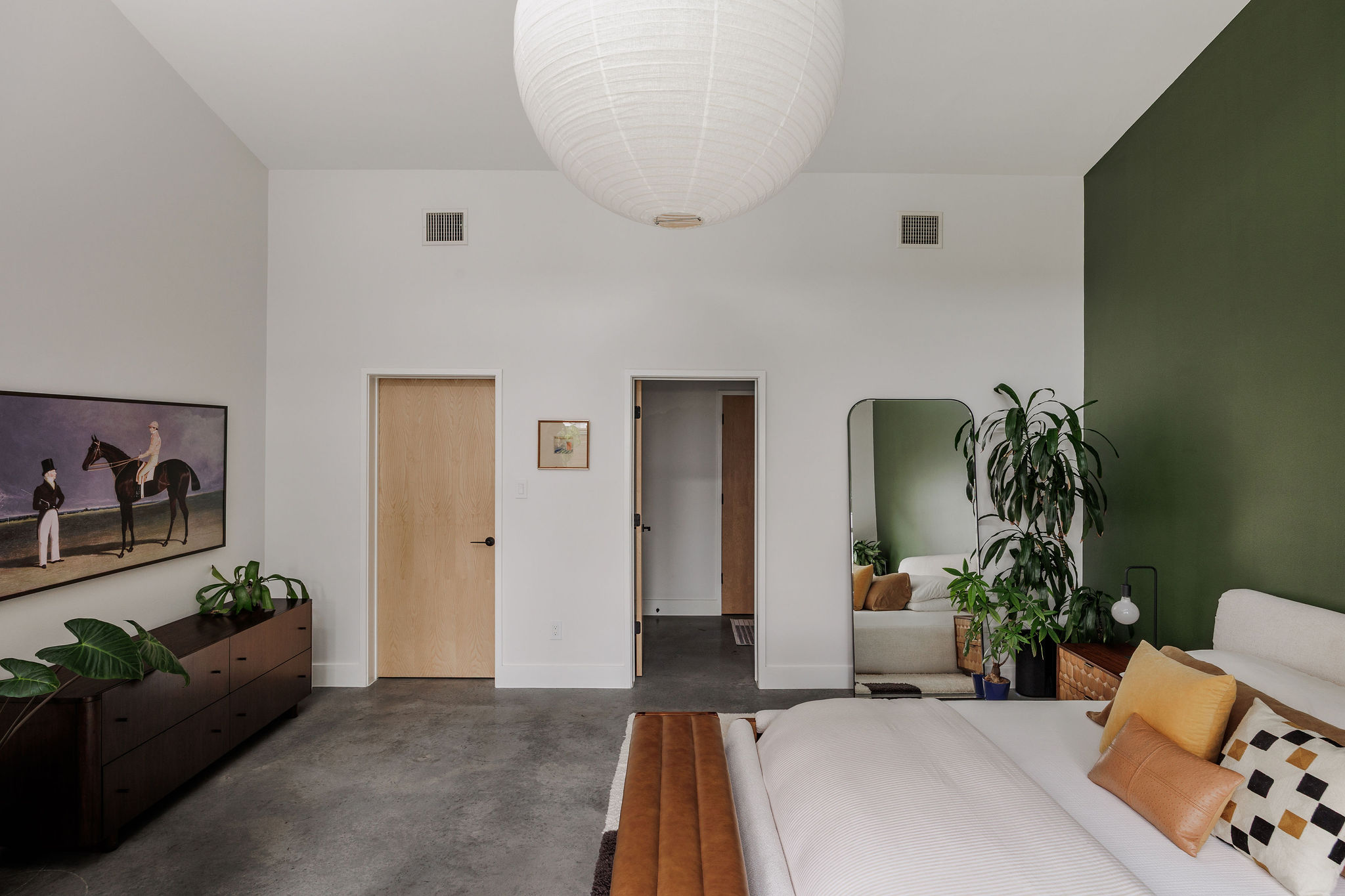 1605 Maple Avenue Austin, TX 78702 - Photo 21 of 33 Vaulted ceilings enhance this space featuring light wood-finish doors and dark concrete flooring