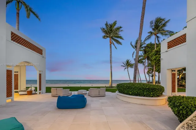 a view of a chairs and table in the patio