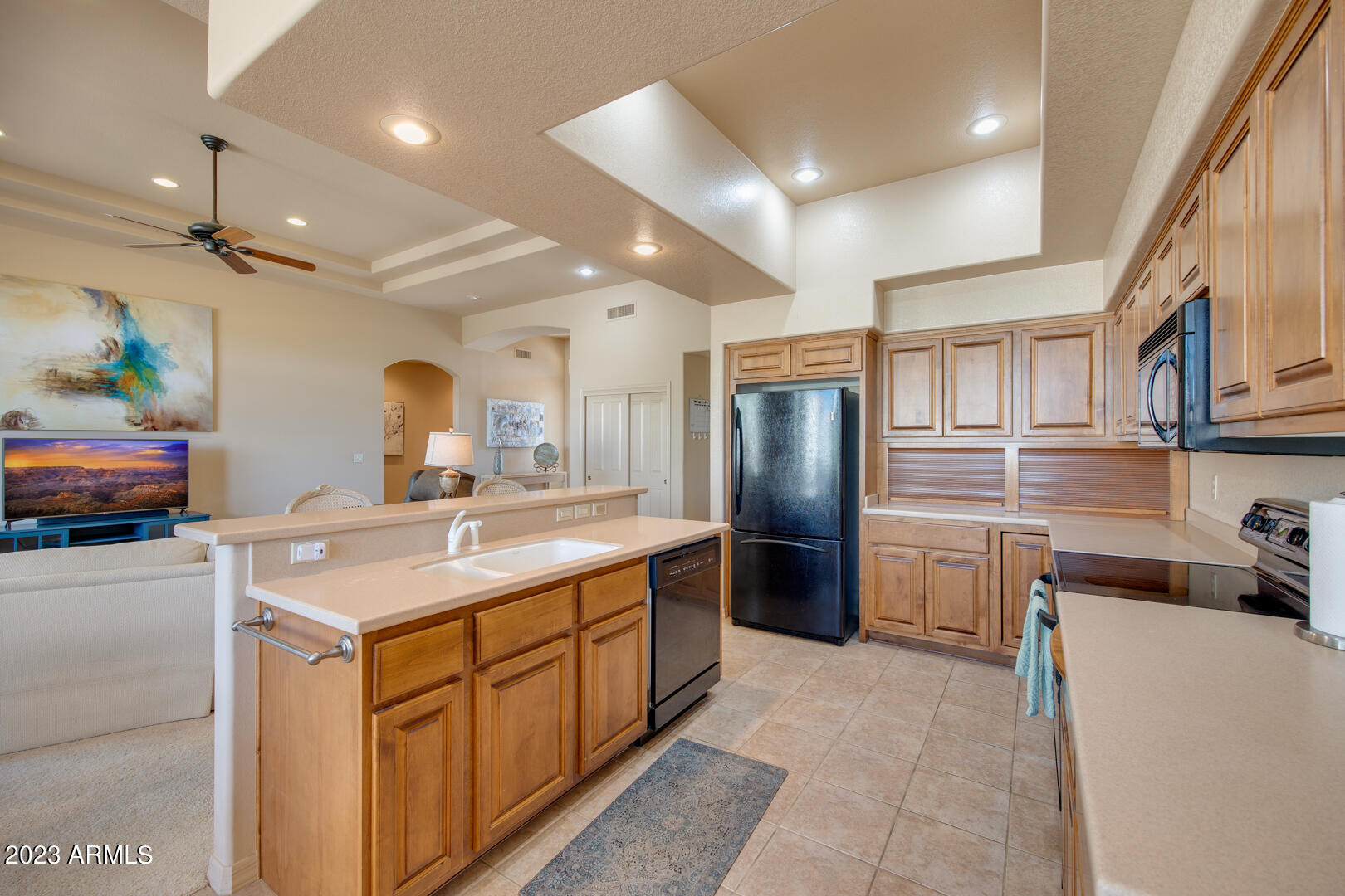25603 North Sago Drive Rio Verde, AZ 85263 - Photo 4 of 25 a kitchen with stainless steel appliances granite countertop a sink a stove and a refrigerator