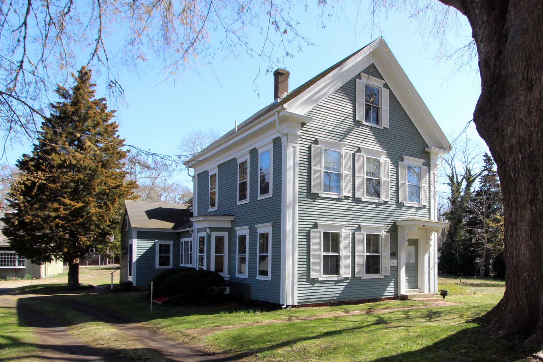 220 Locust Road Eastham, MA 02642 - Photo 2 of 50 a front view of a house with garden
