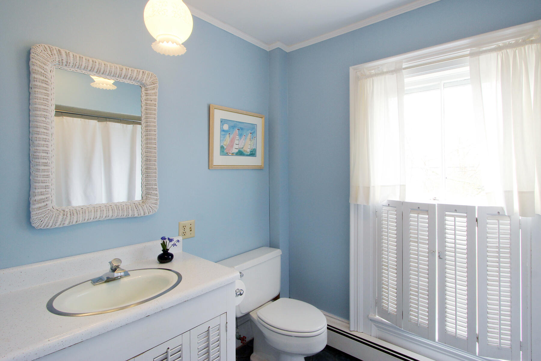 220 Locust Road Eastham, MA 02642 - Photo 29 of 50 a bathroom with a granite countertop sink toilet a mirror and a window