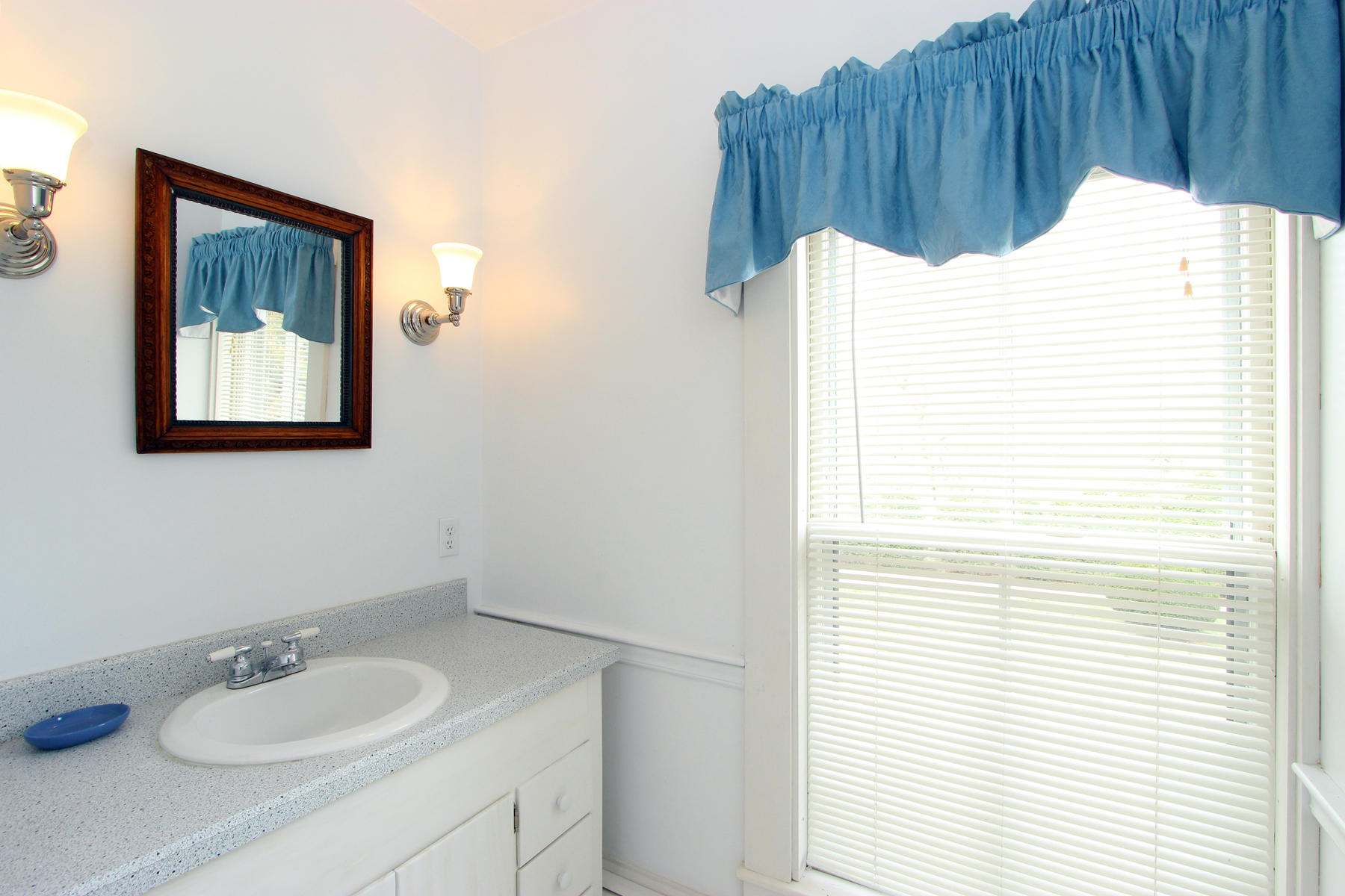 220 Locust Road Eastham, MA 02642 - Photo 33 of 50 a bathroom with a sink a toilet and mirror