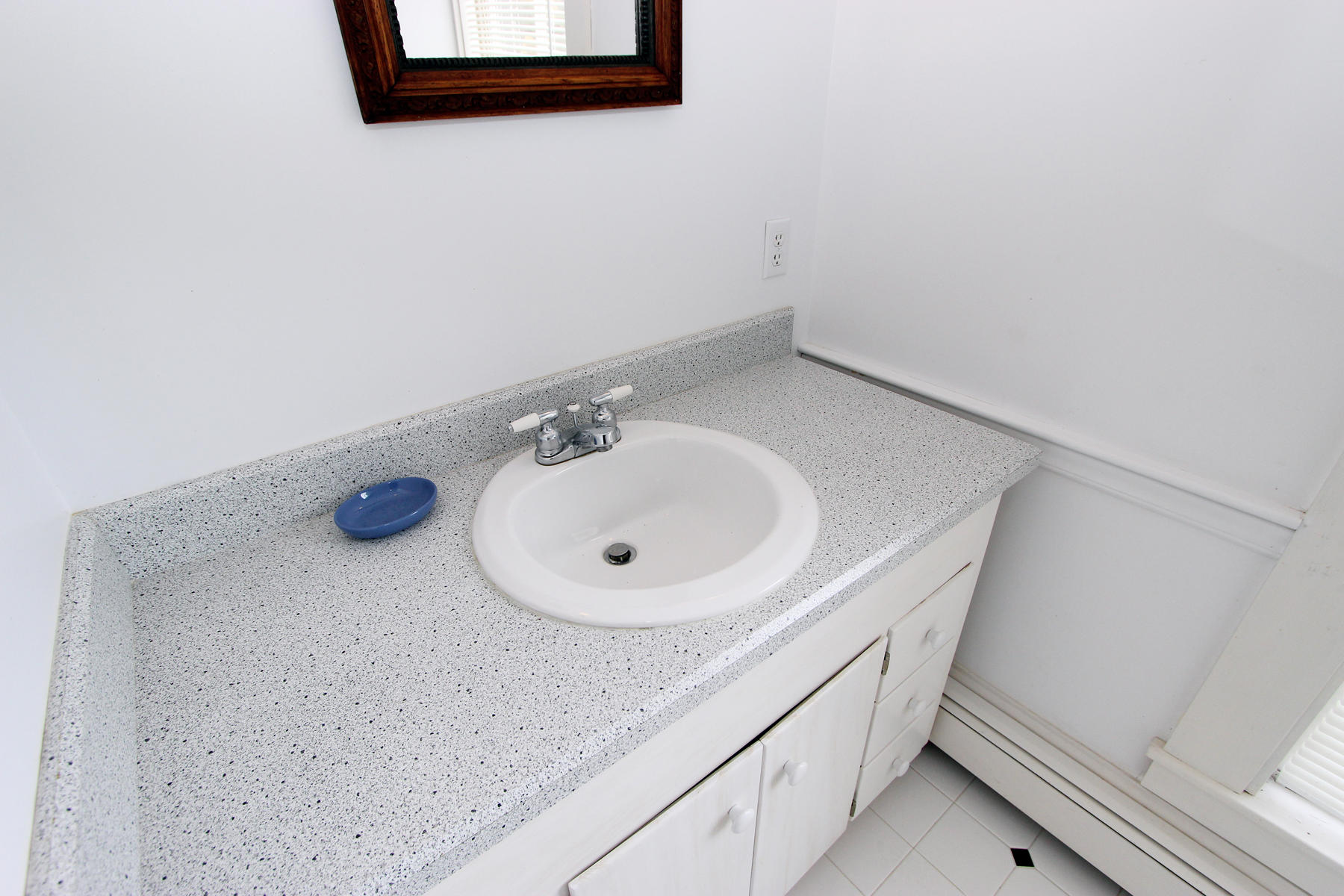 220 Locust Road Eastham, MA 02642 - Photo 34 of 50 a bathroom with a sink and a mirror