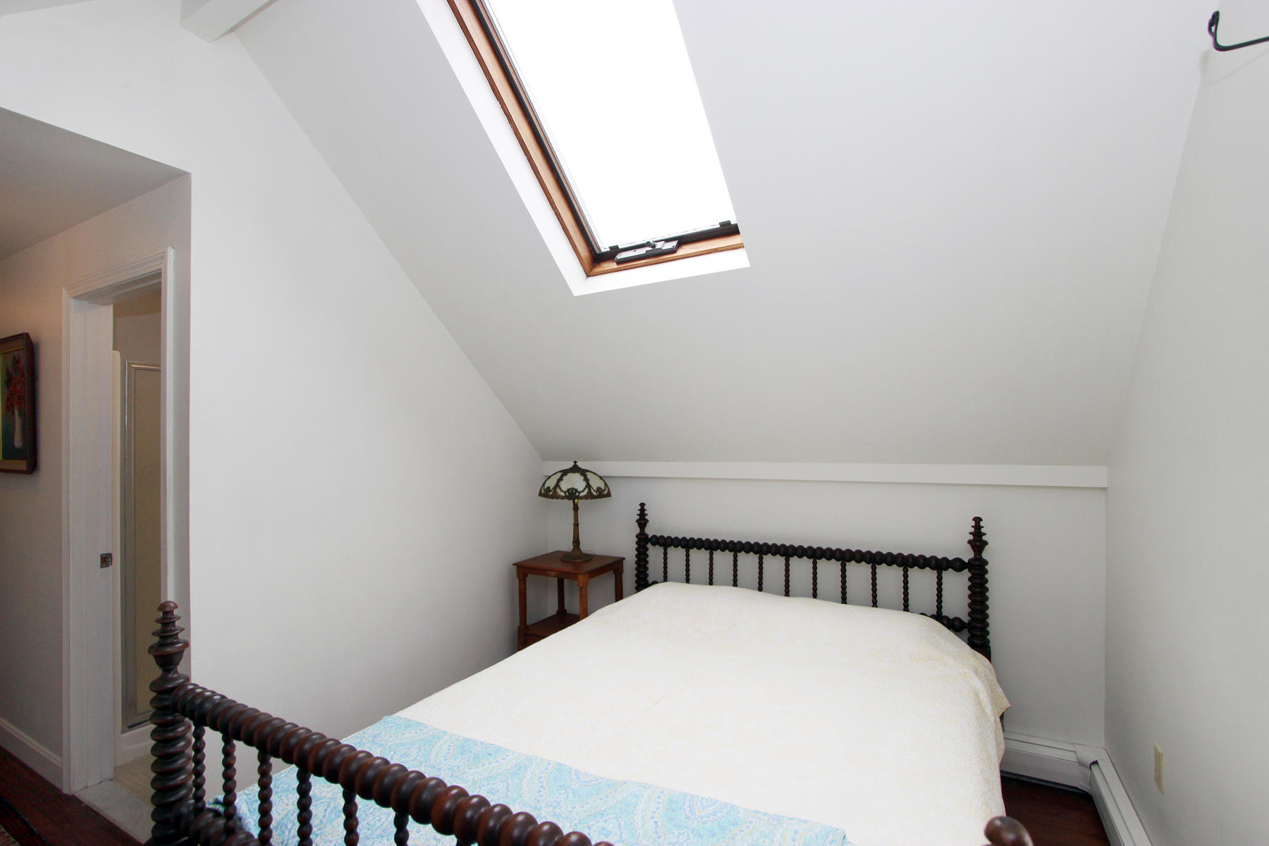 220 Locust Road Eastham, MA 02642 - Photo 36 of 50 a bed sitting in a bedroom next to a window