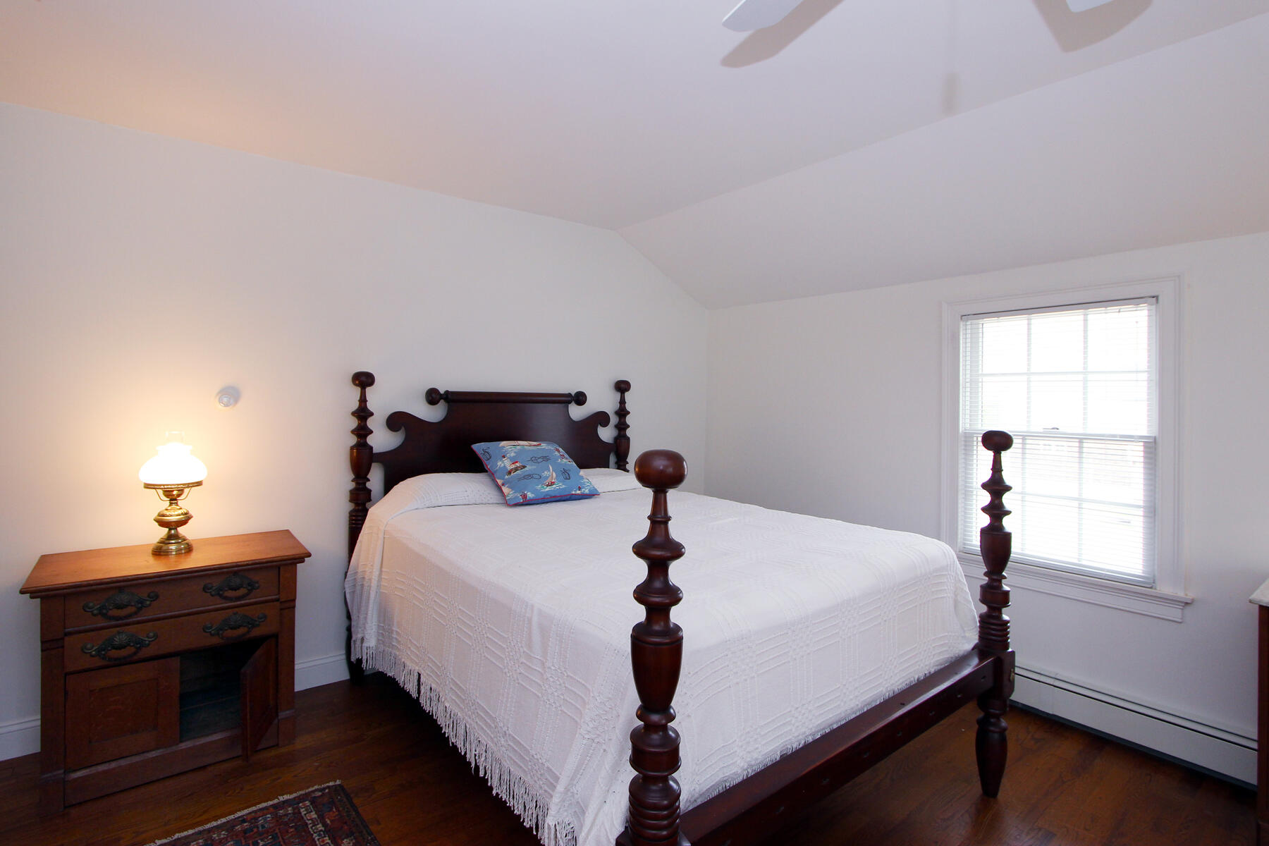 220 Locust Road Eastham, MA 02642 - Photo 38 of 50 a bed sitting in a bedroom next to a window