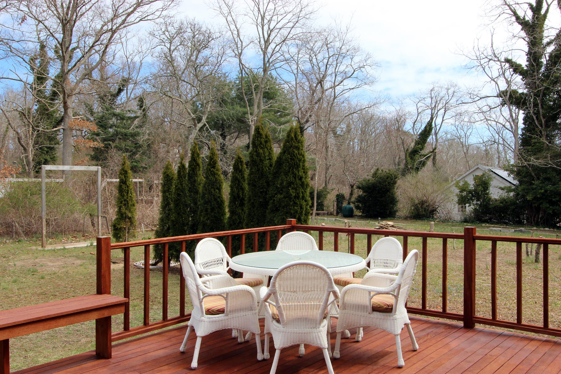 220 Locust Road Eastham, MA 02642 - Photo 44 of 50 a view of roof deck with chairs and wooden fence