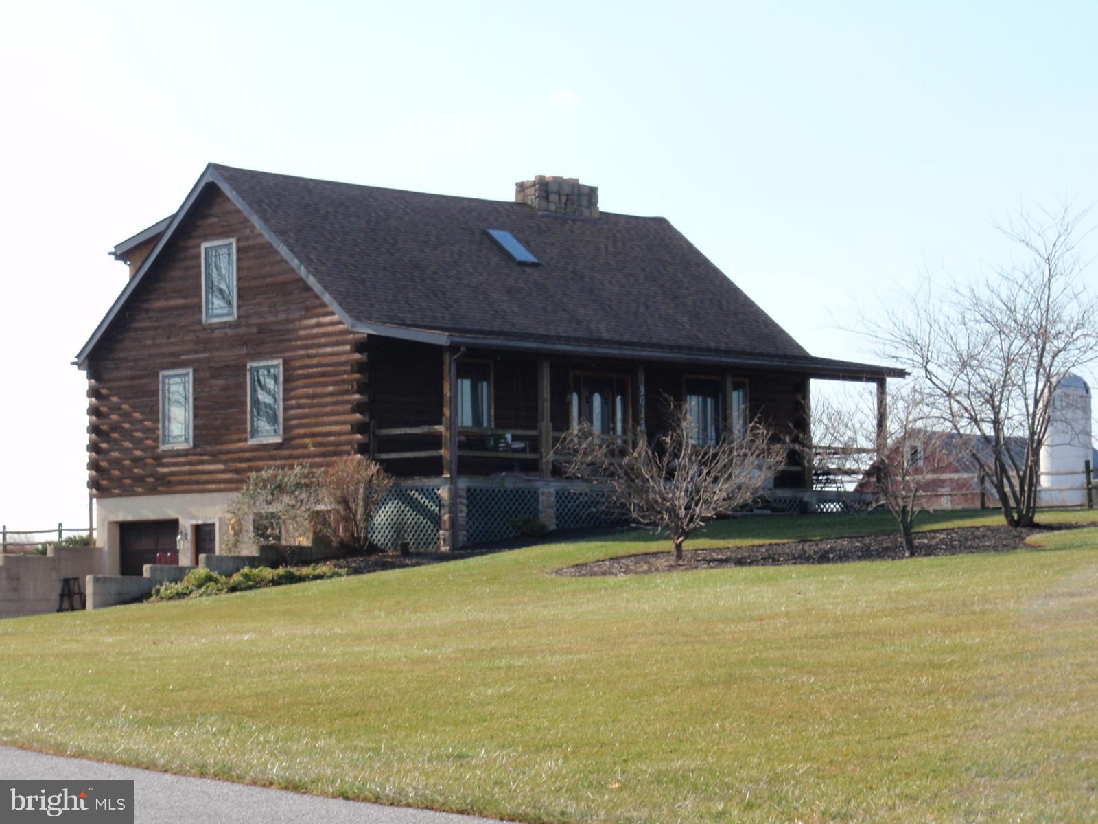 9013 Old Mill Road Rocky Ridge, MD 21778 - Photo 1 of 16 a front view of a house with a yard