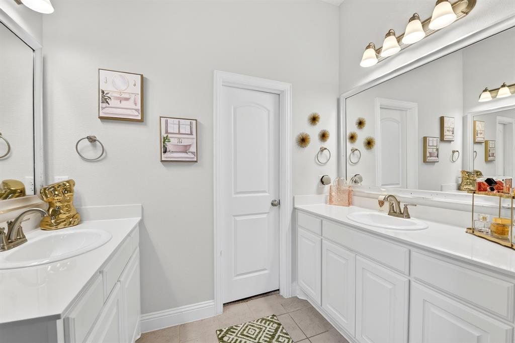 136 Gleeson Drive Red Oak, TX 75154 - Photo 26 of 40 a bathroom with a double vanity sink mirror and double