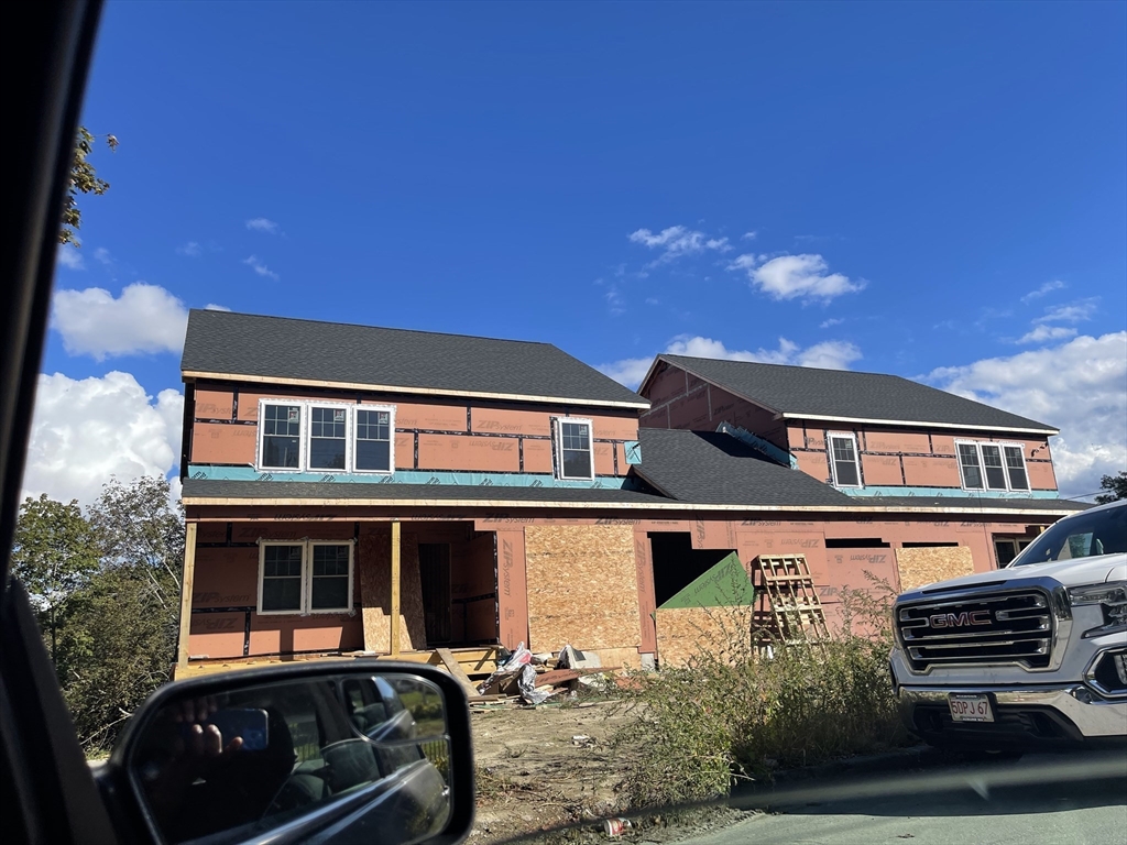 29 Steele Street Worcester, MA 01607 - Photo 1 of 6 a front view of a house with a yard