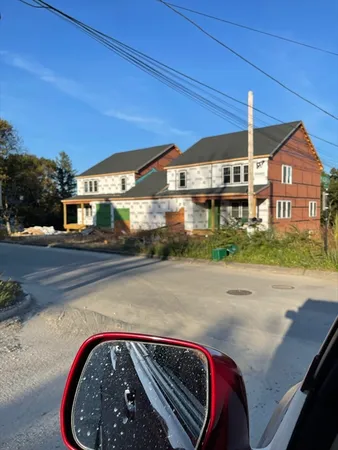 a view of a house with a street