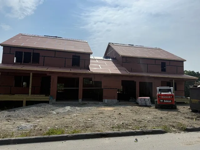 a view of a car parked in front of a house