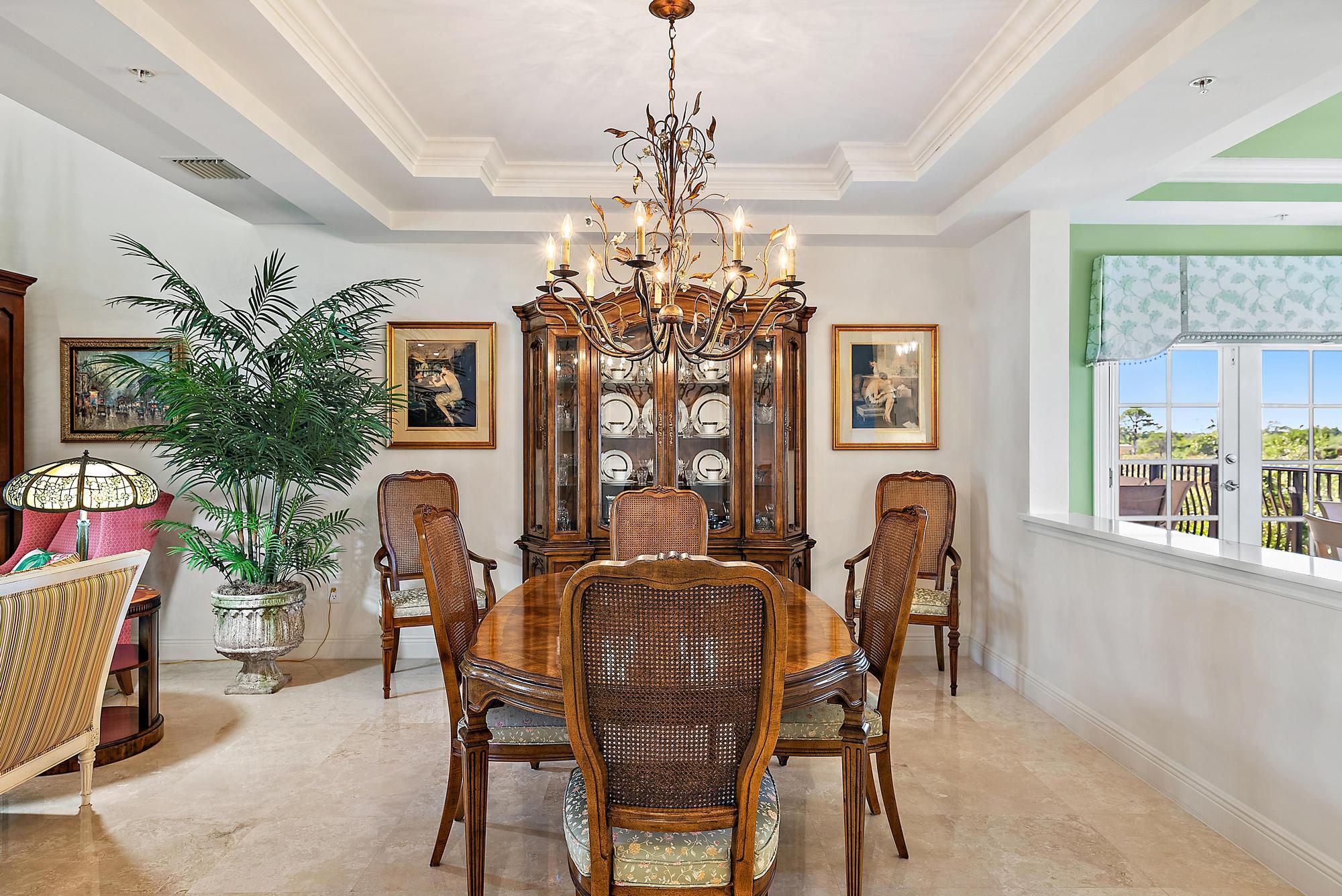 126 Tierra Lane, Unit 2 Jupiter, FL 33477 - Photo 23 of 59 a view of a dining room with furniture and window