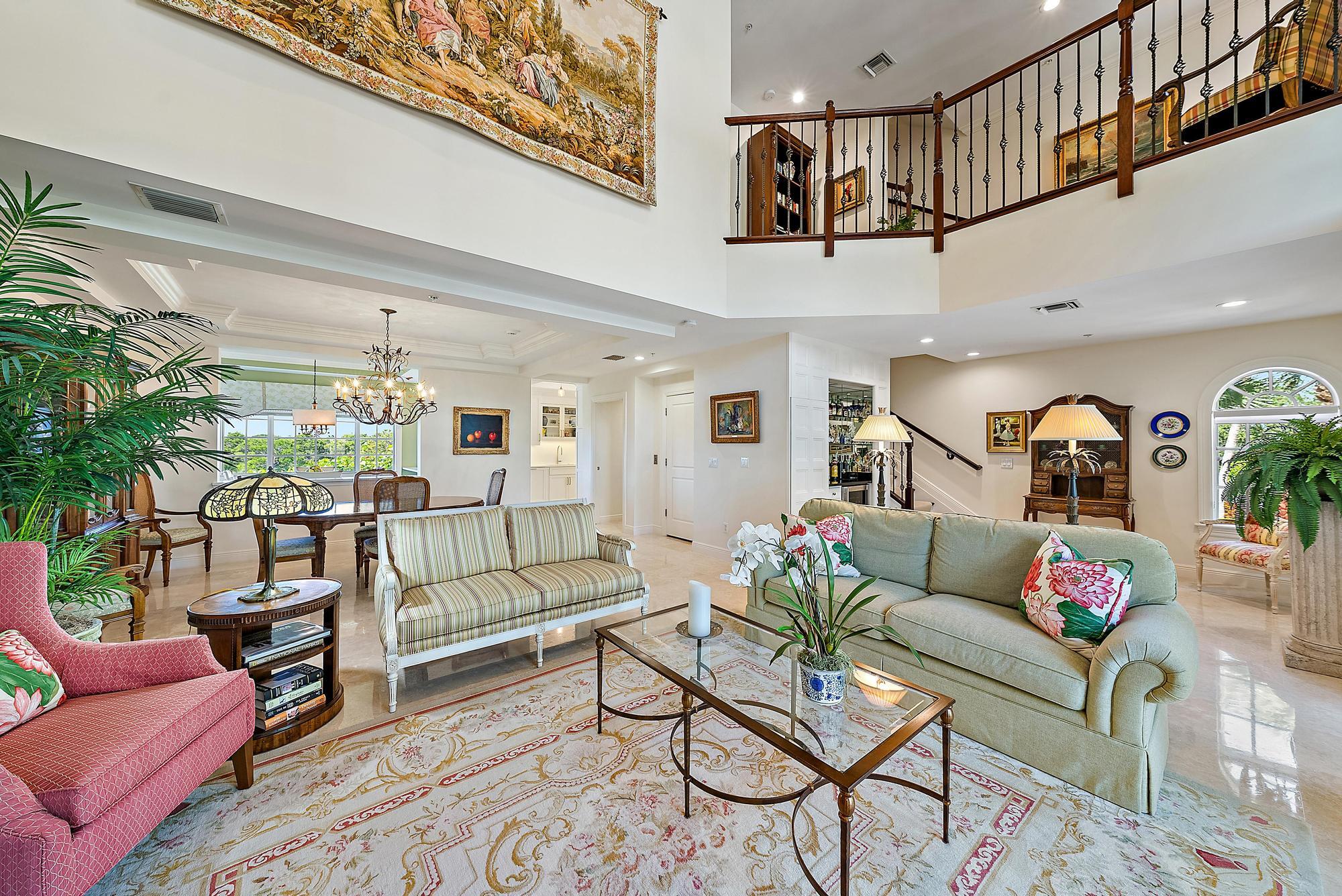 126 Tierra Lane, Unit 2 Jupiter, FL 33477 - Photo 25 of 59 a living room with furniture and wooden floor