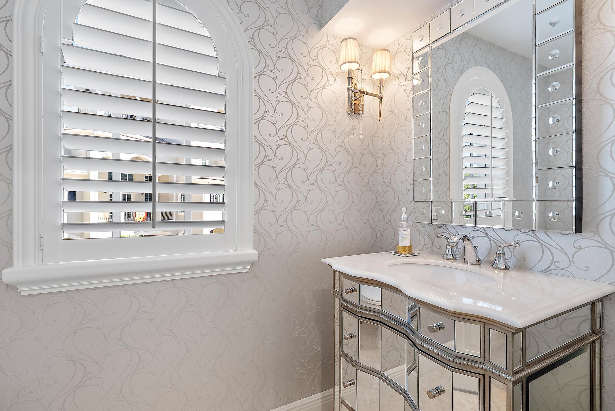 126 Tierra Lane, Unit 2 Jupiter, FL 33477 - Photo 27 of 59 a bathroom with a sink and a mirror