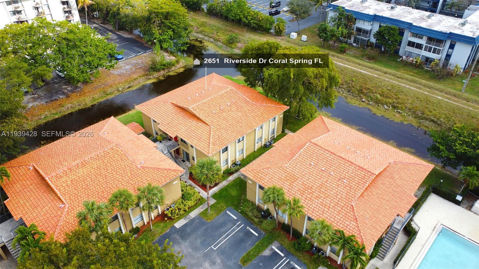 2651 Riverside Drive, Unit 3 Coral Springs, FL 33065 - Photo 1 of 29 an aerial view of residential houses with outdoor space