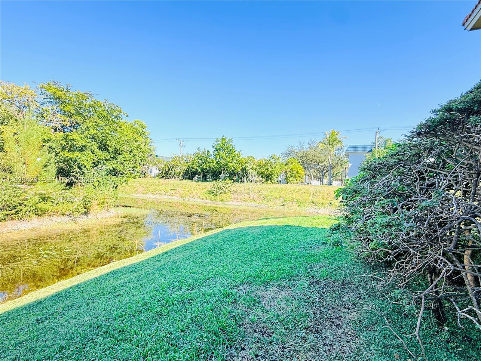 2651 Riverside Drive, Unit 3 Coral Springs, FL 33065 - Photo 19 of 29 a view of an ocean from a yard