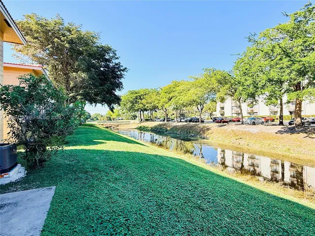 a view of a garden with a building
