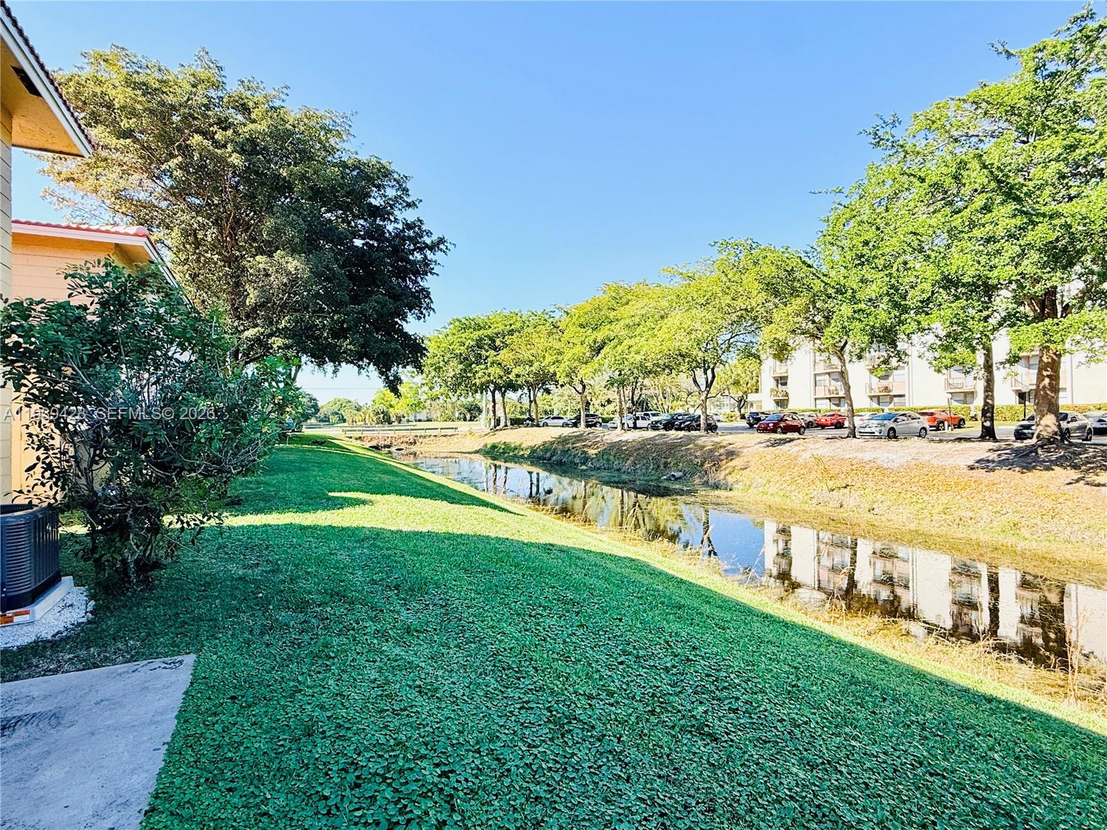 2651 Riverside Drive, Unit 3 Coral Springs, FL 33065 - Photo 21 of 29 a view of an outdoor space and swimming pool