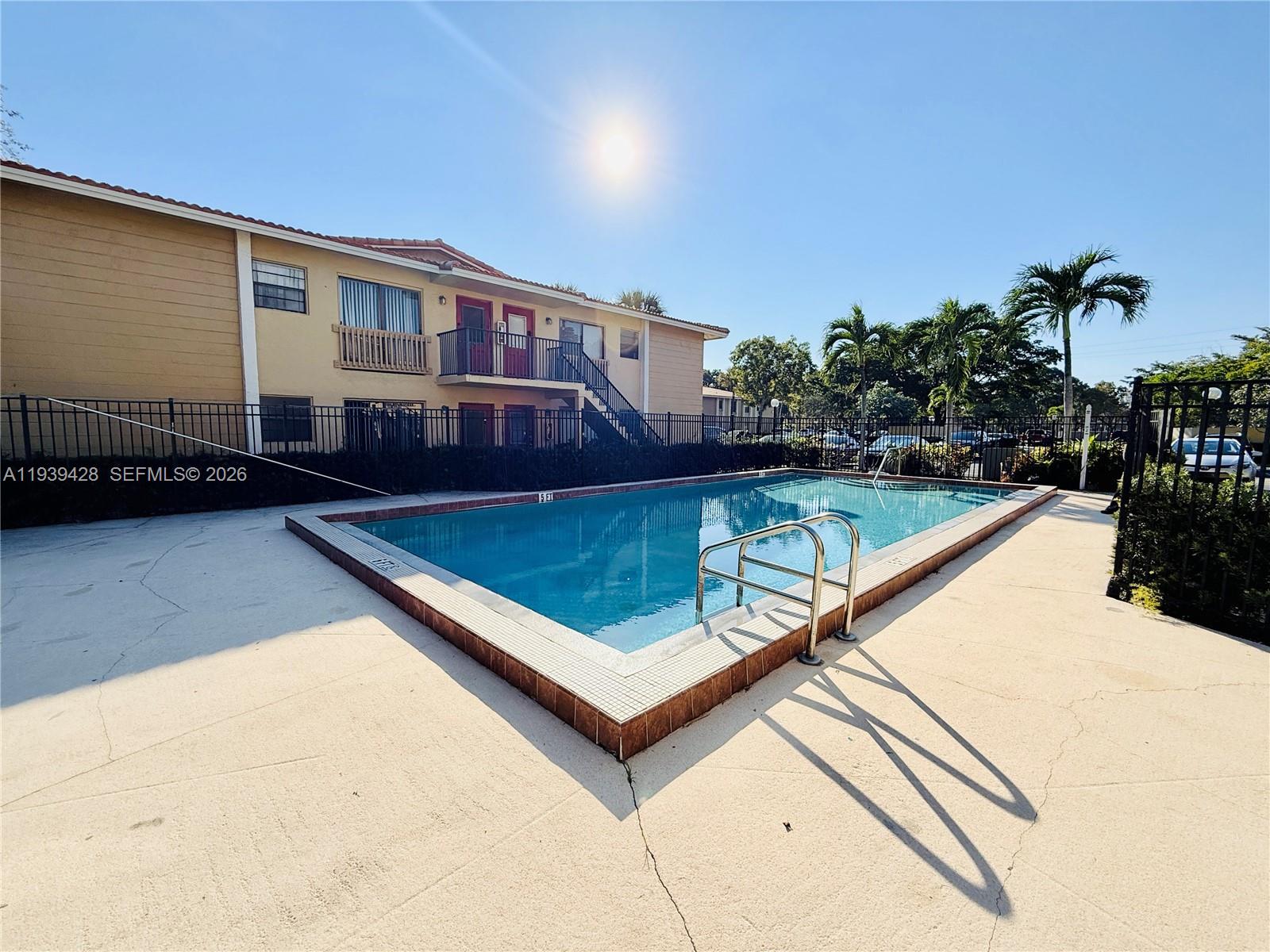 2651 Riverside Drive, Unit 3 Coral Springs, FL 33065 - Photo 25 of 29 a view of swimming pool with a lounge chairs