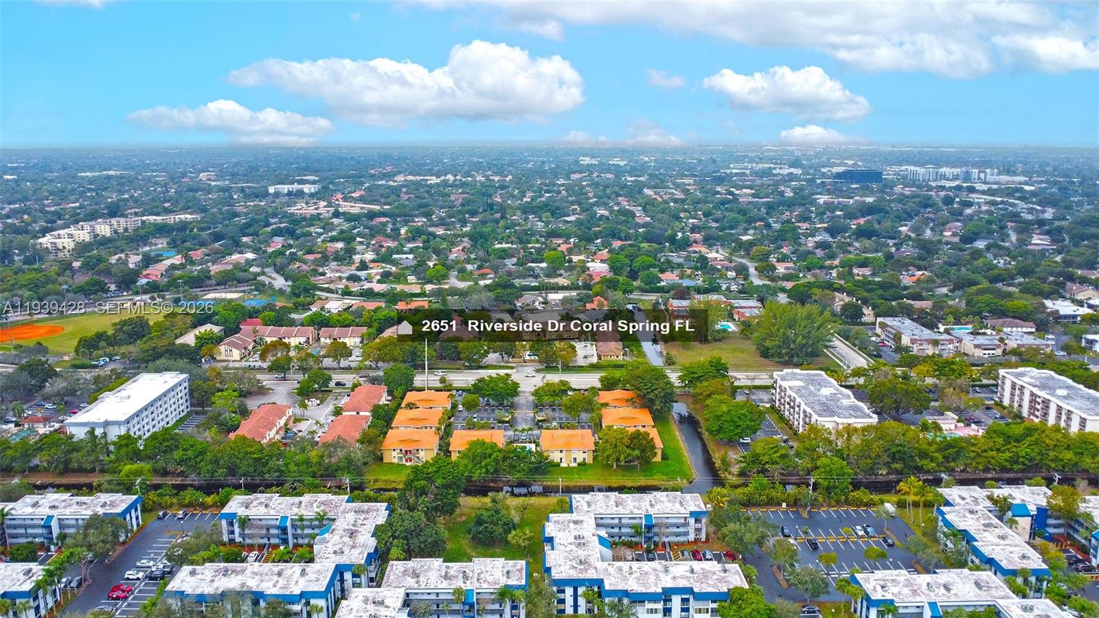 2651 Riverside Drive, Unit 3 Coral Springs, FL 33065 - Photo 28 of 29 an aerial view of residential houses with city view