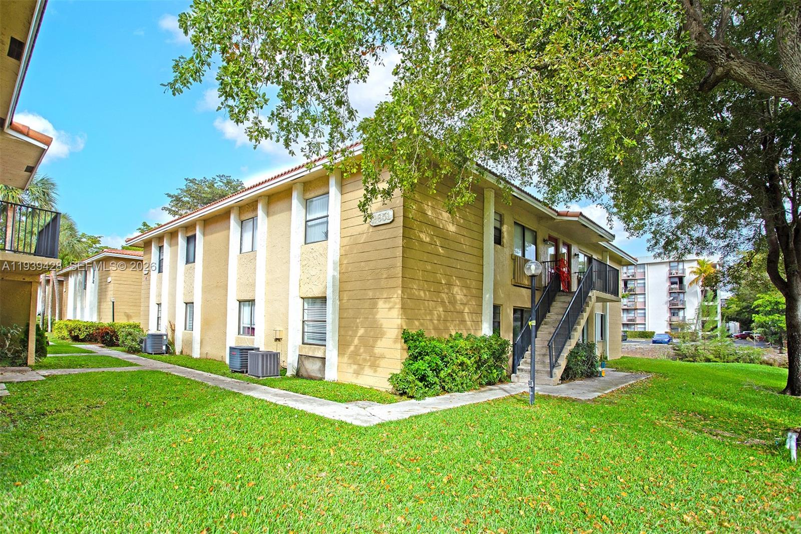 2651 Riverside Drive, Unit 3 Coral Springs, FL 33065 - Photo 3 of 29 a front view of a house with a yard