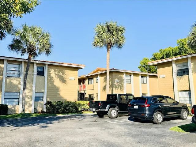 a view of a car parked in front of a house