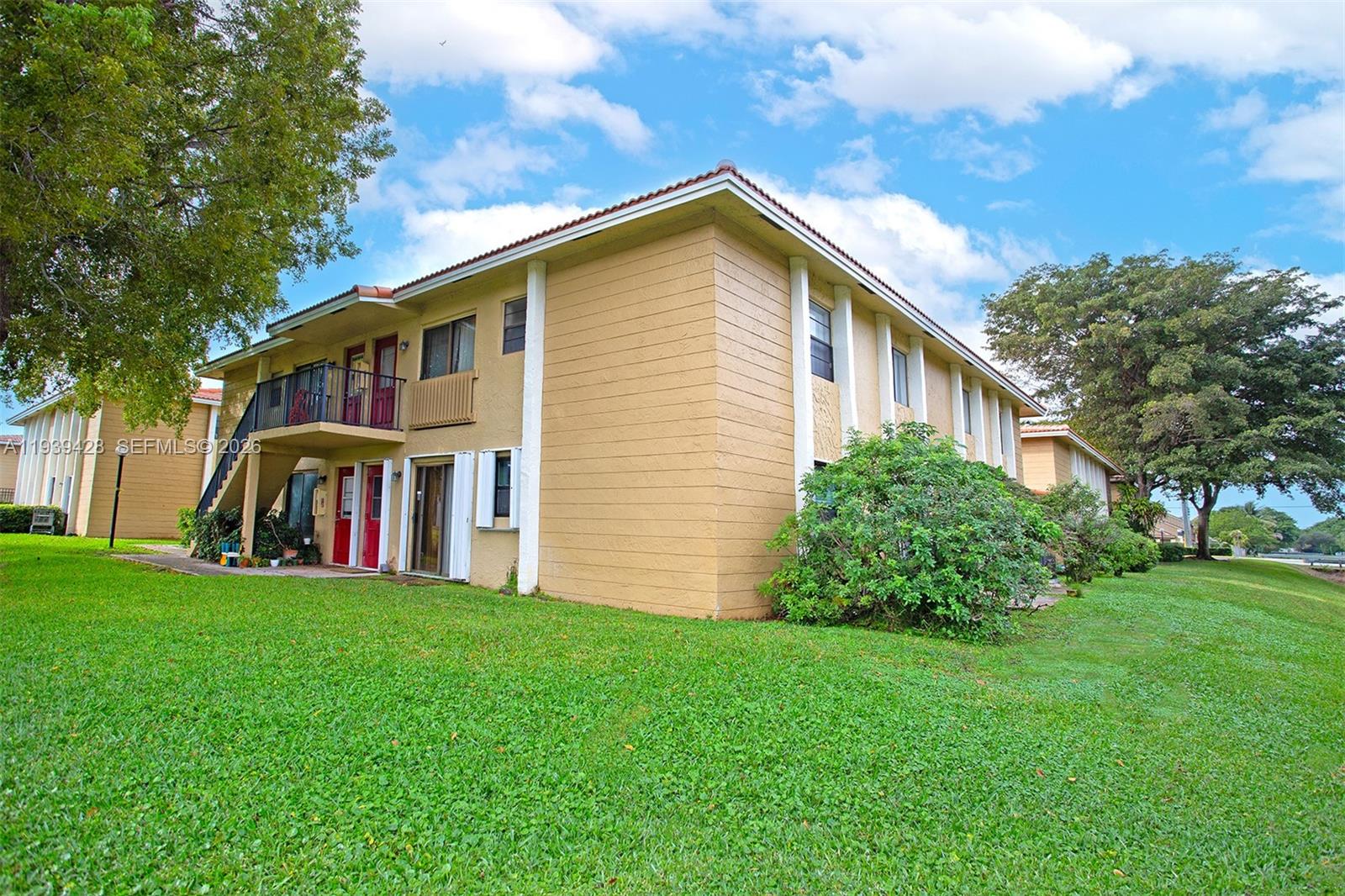 2651 Riverside Drive, Unit 3 Coral Springs, FL 33065 - Photo 5 of 29 a view of a house with a yard