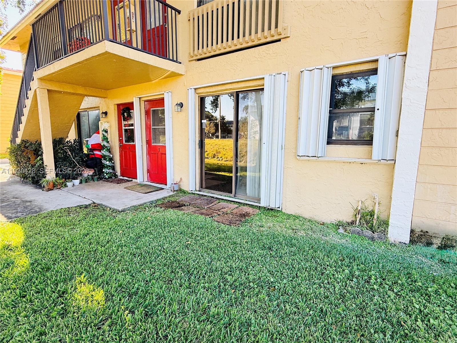 2651 Riverside Drive, Unit 3 Coral Springs, FL 33065 - Photo 6 of 29 a view of a house with backyard and porch