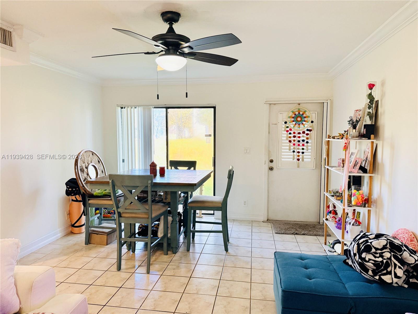 2651 Riverside Drive, Unit 3 Coral Springs, FL 33065 - Photo 9 of 29 a view of a dining room with furniture and a window