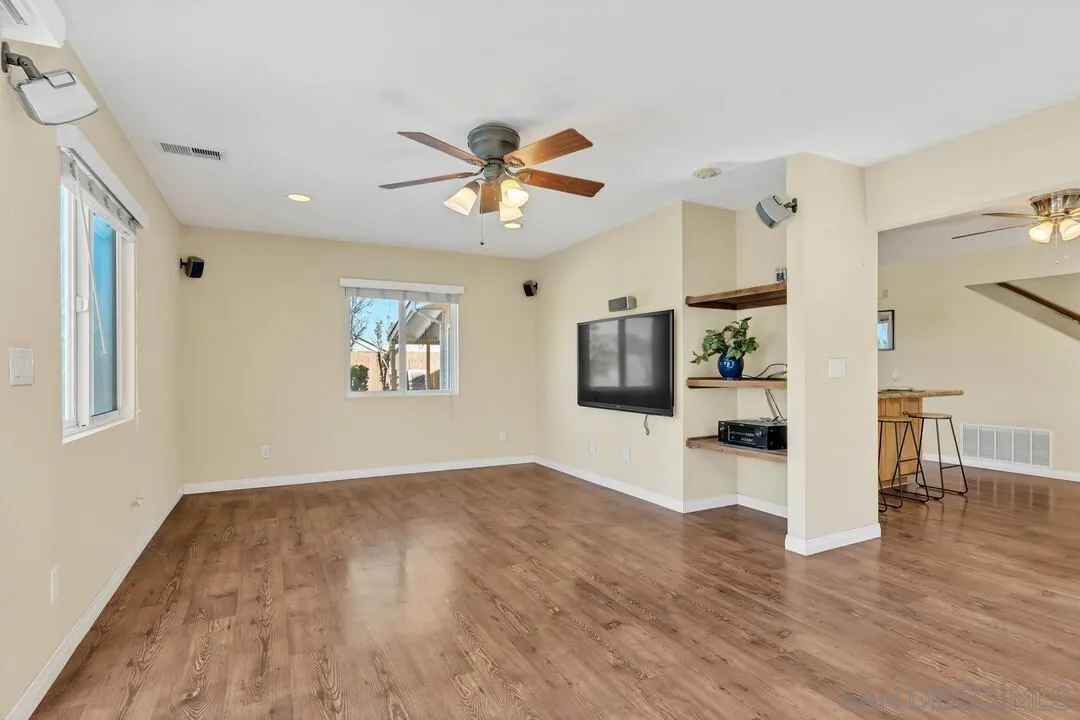 12232 Colony Drive Poway, CA 92064 - Photo 17 of 61 a view of empty room with wooden floor and fan