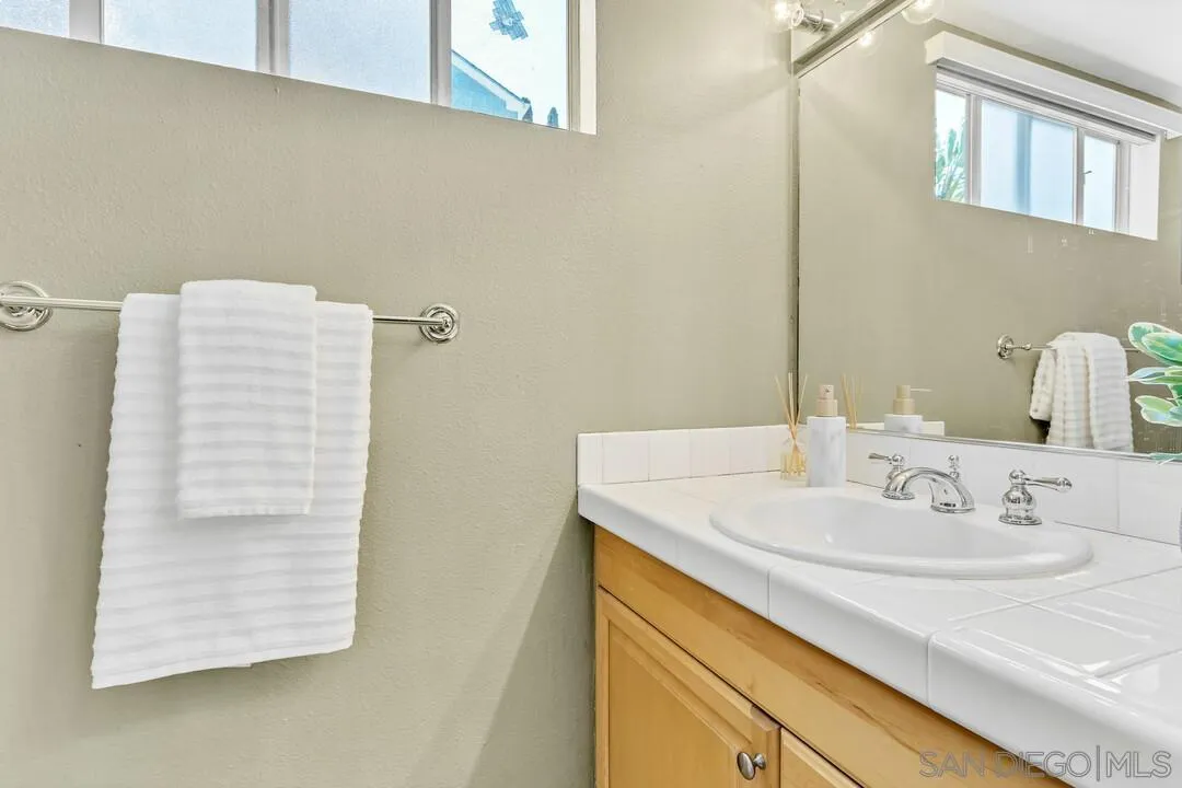 12232 Colony Drive Poway, CA 92064 - Photo 20 of 61 a bathroom with a sink and a mirror