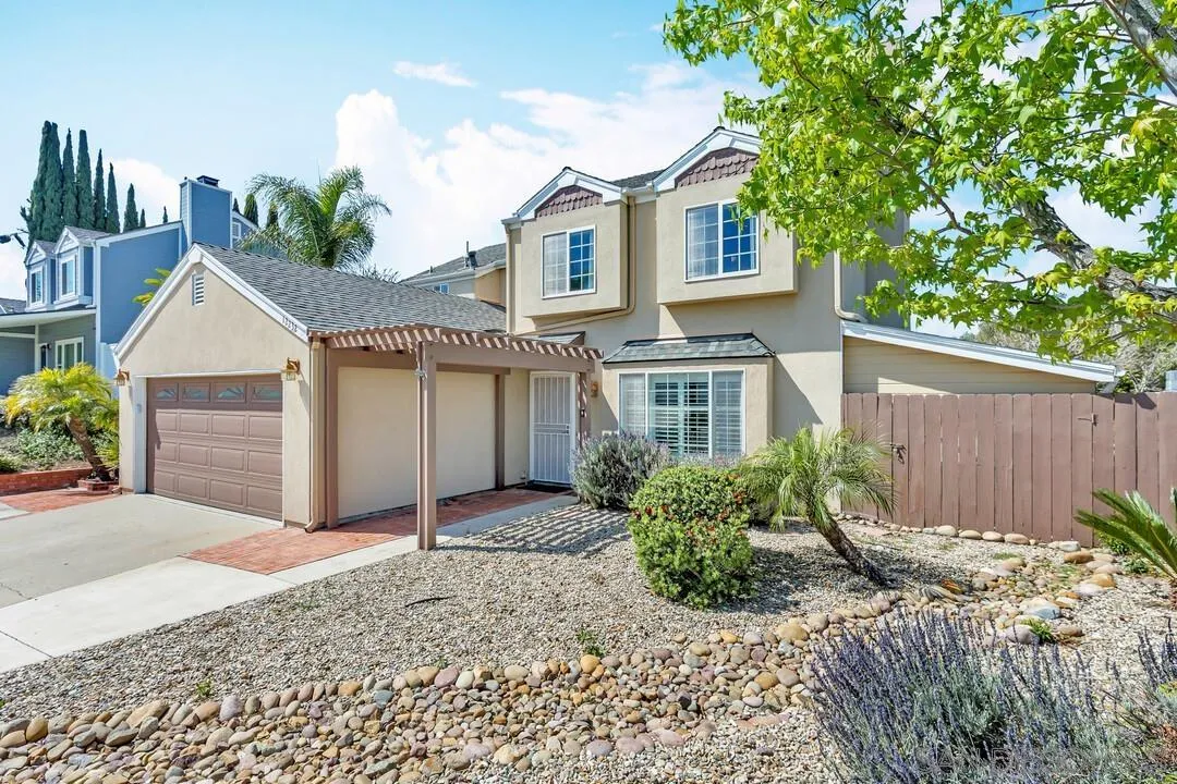 12232 Colony Drive Poway, CA 92064 - Photo 2 of 61 a front view of a house with garden