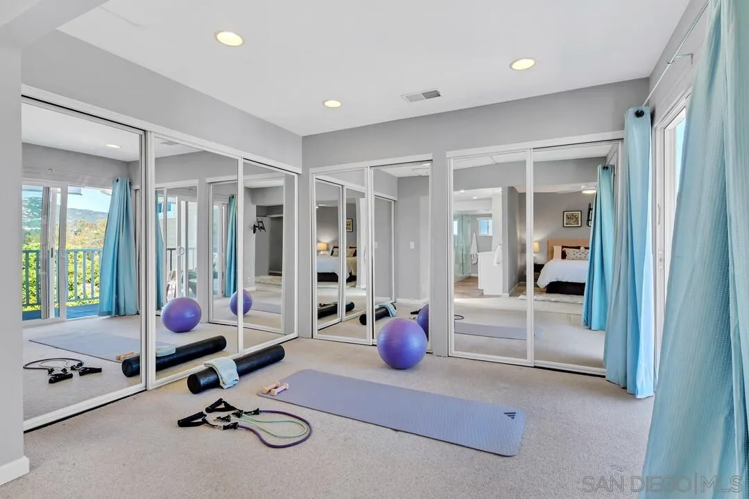 12232 Colony Drive Poway, CA 92064 - Photo 24 of 61 a living room with furniture large window and wooden floor