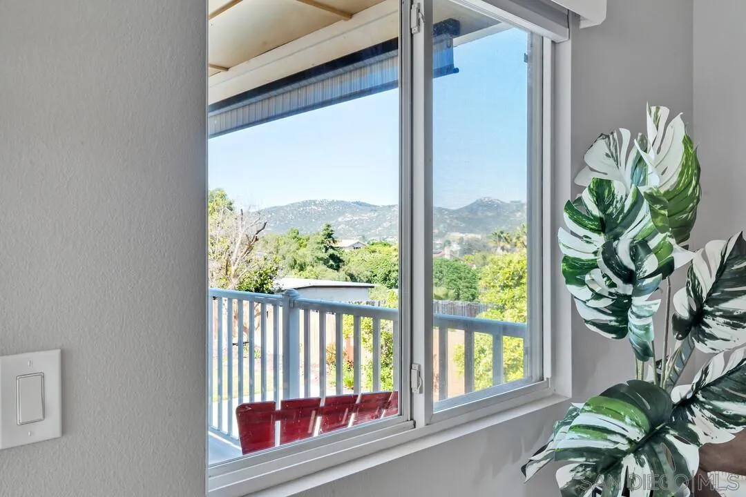 12232 Colony Drive Poway, CA 92064 - Photo 27 of 61 a view of a porch with a floor to ceiling window