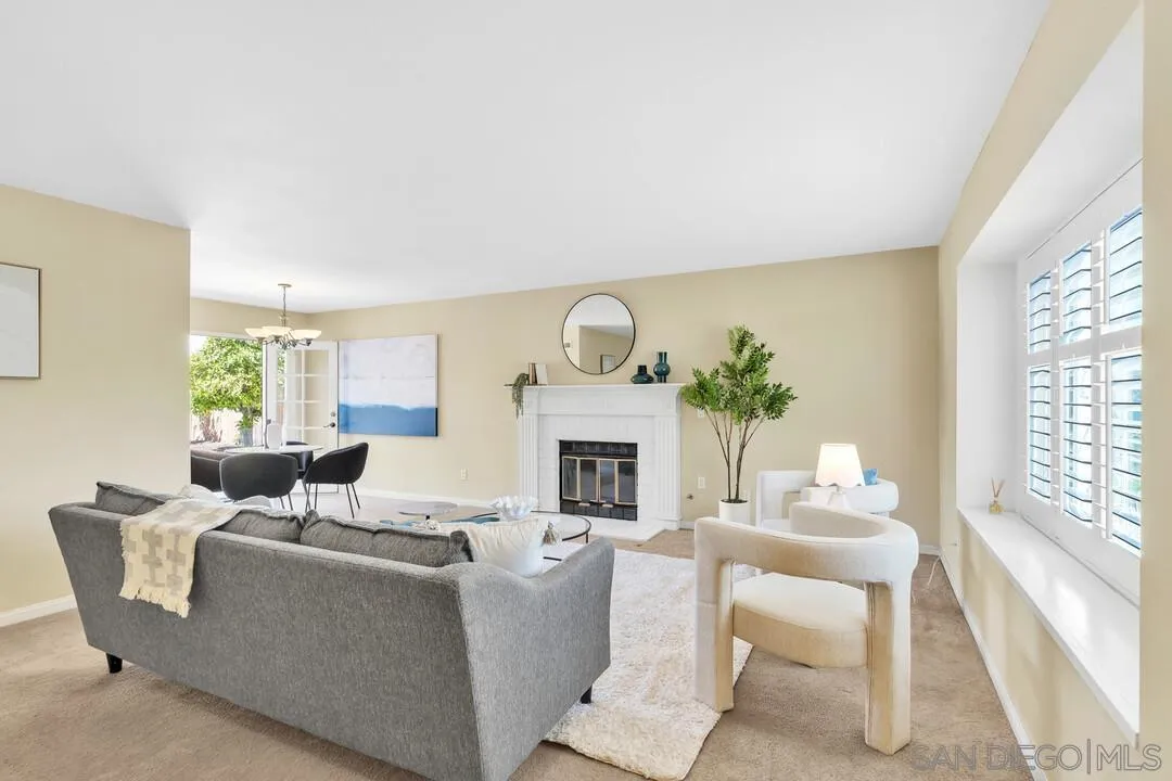 12232 Colony Drive Poway, CA 92064 - Photo 3 of 61 a living room with furniture a fireplace and a large window