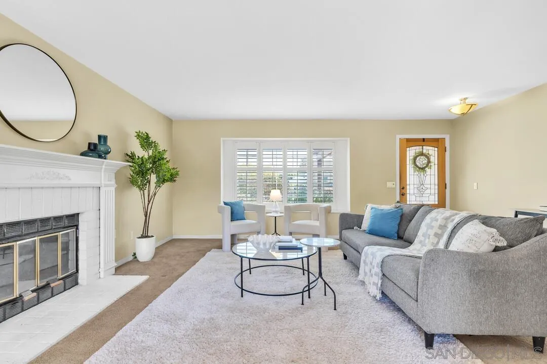 12232 Colony Drive Poway, CA 92064 - Photo 4 of 61 a living room with furniture and a fireplace