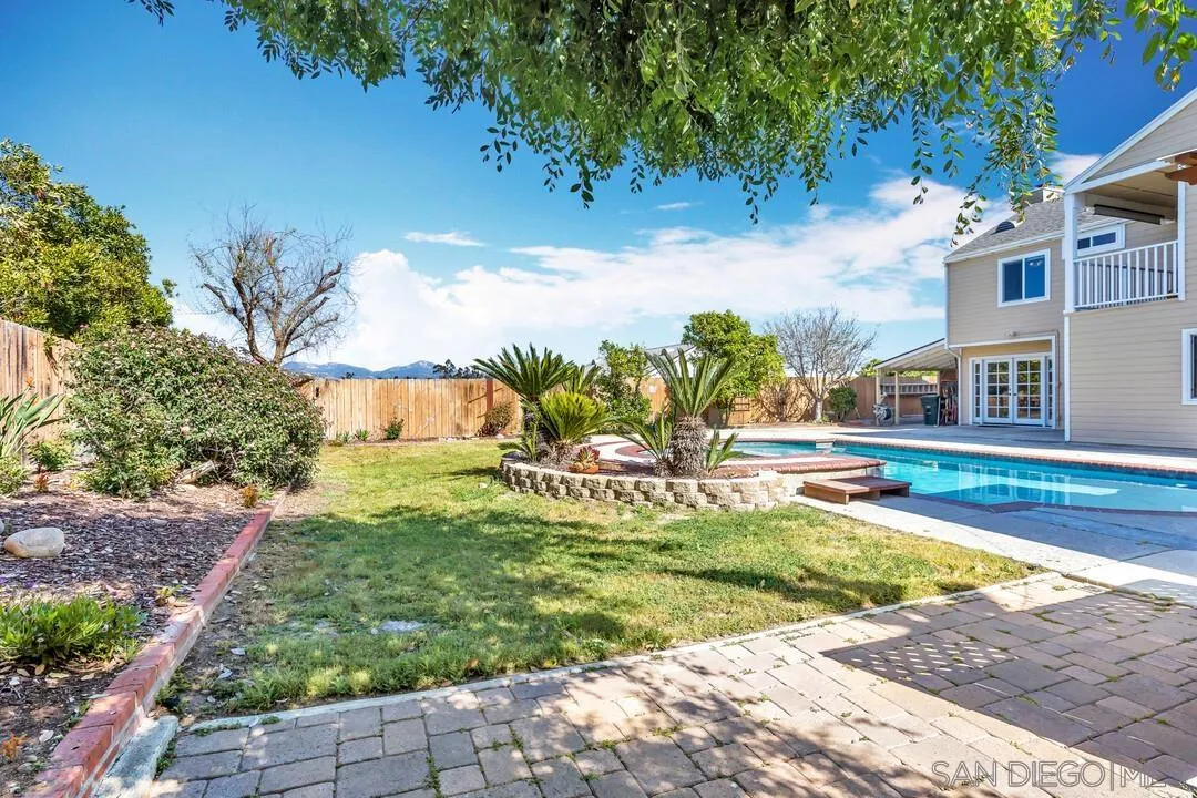12232 Colony Drive Poway, CA 92064 - Photo 49 of 61 a view of swimming pool with lawn chairs and plants