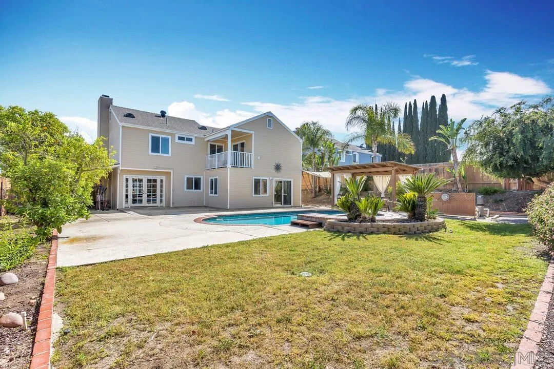 12232 Colony Drive Poway, CA 92064 - Photo 50 of 61 a view of a house with a yard patio and fire pit