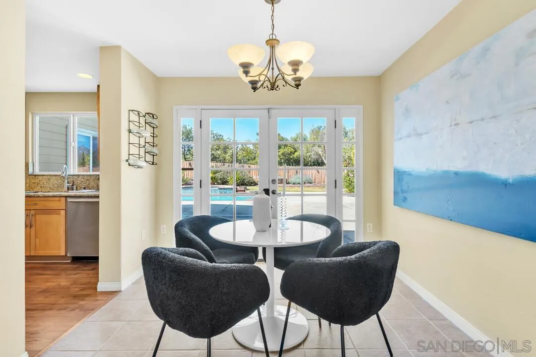 12232 Colony Drive Poway, CA 92064 - Photo 7 of 61 a dining room with furniture and a chandelier