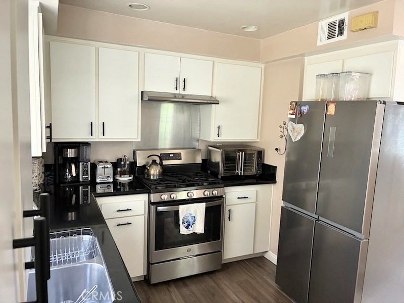 2249 Montrose Avenue, Unit 7 Montrose, CA 91020 - Photo 17 of 54 a kitchen with stainless steel appliances granite countertop a stove a refrigerator and a refrigerator